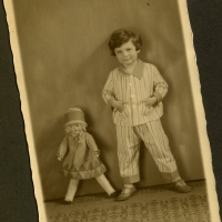 Eva in pajamas, posing with her doll. April 1926.