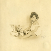 Eva playing with her toys. October 1924.