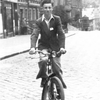 Henry Friedman on bike, in the town of Gliwice, Silesia. 1945.