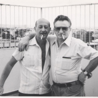 Sobibor survivors Stanislaw (Schlomo) Szmajzner and Thomas (Toivi) Blatt on Shlomo’s balcony in Goiania, Brazil (circa 1983).