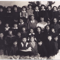 Public School in Izbica, Poland. "In the middle, on both sided of the lady with the hat are my two teachers- Jewish sisters." - Thomas Blatt