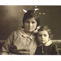 Noémi (12 years old) with her 3-year-old sister Erzsebet, 1934.