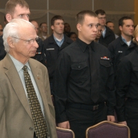 Holocaust survivor Fred Taucher stands during the National Anthem at a Holocaust Remembrance Day program.  (Everett, WA April 12, 2007)