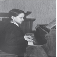 Young Robert before the war, playing his dreaded piano.