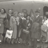 Ada (left) in front of a plane going from Sweden to Amsterdam, July 28, 1945.